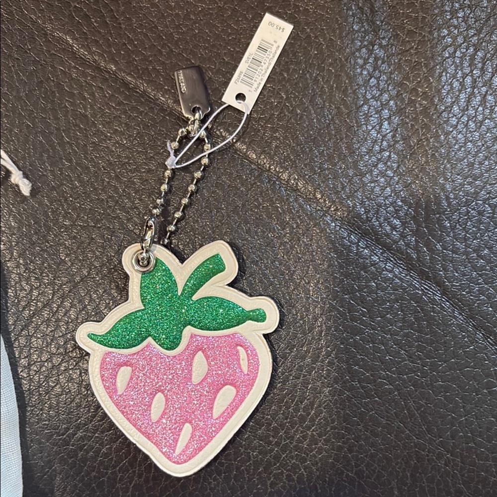 Coach strawberry sparkle key chain with duster bag